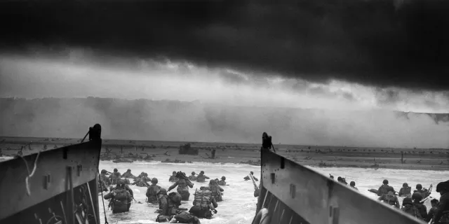 Allied troops wading ashore on the coast of Normandy on 6 June 1944